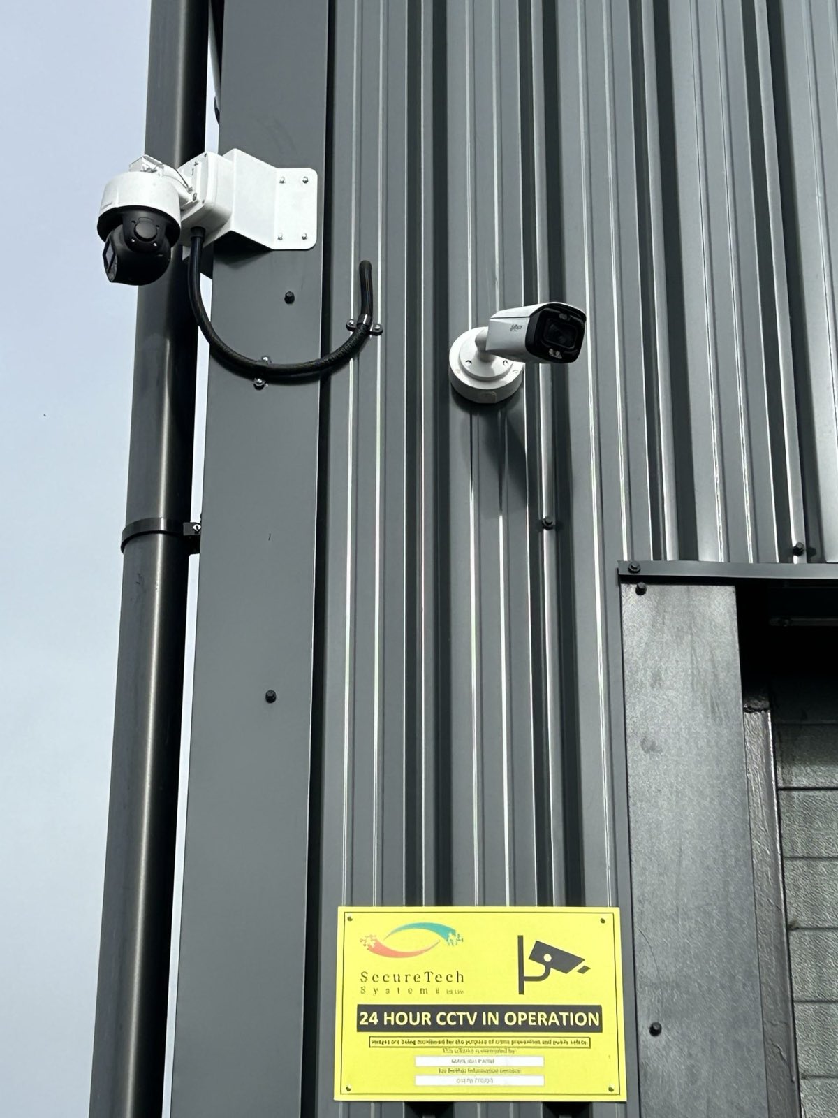 Bullet and PTZ CCTV cameras on commercial cladding