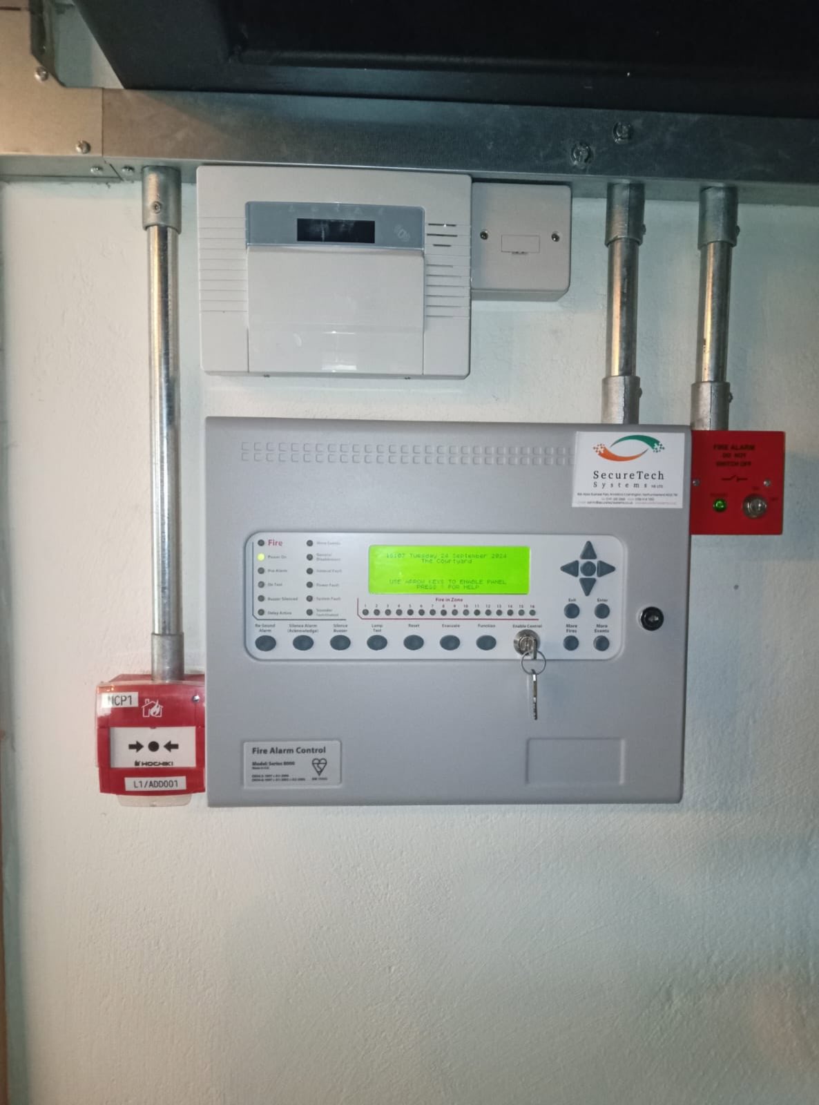 Fire alarm control panel in a plant room