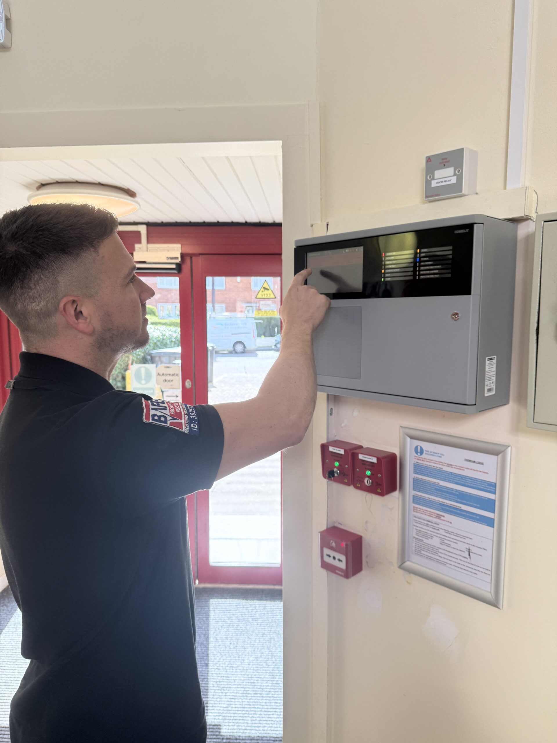 Picture of a main installing a fire alarm